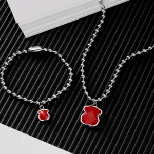Conjunto de bolitas y oso de color
