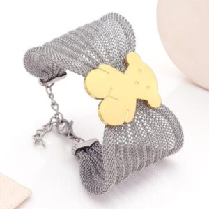 Pulsera ancha de malla con oso dorado